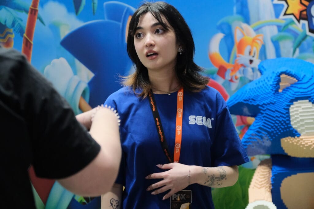 A woman is talking to a lego sonic.