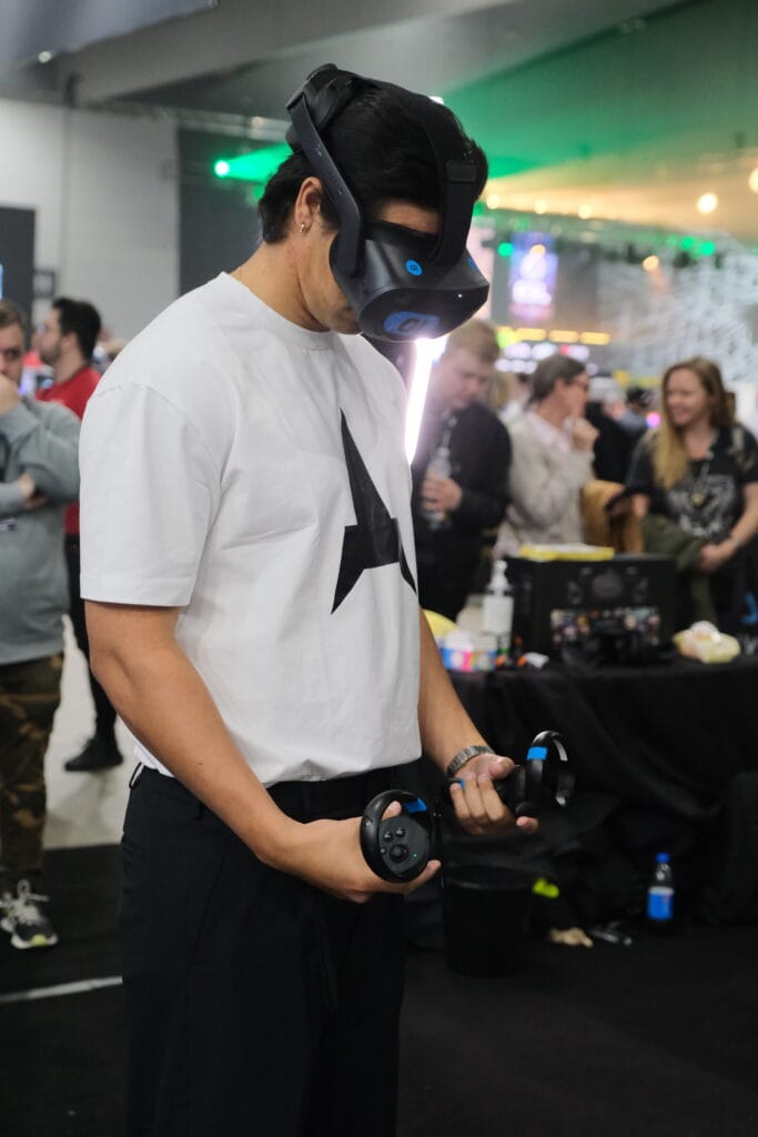A man wearing a vr headset at a convention.